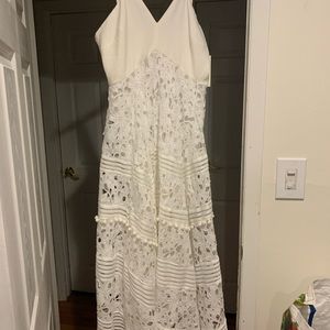Gorgeous white eyelet dress. Never worn. Still has tags. Midi dress.